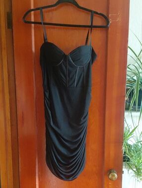 Sleek Black Bustier Mini Dress with Ruched Skirt